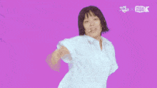 three girls in school uniforms are dancing in front of a purple background that says sudoku
