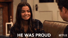 a girl sitting on a couch with the words he was proud written below her