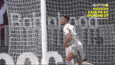 a soccer player celebrates after scoring a goal for sporttv