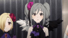 a girl with a red rose in her hair is standing next to a girl with black wings