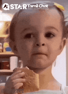 a little girl eating a cookie with a star tamil chat logo in the corner