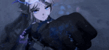 a girl with long hair and blue eyes is holding a fist