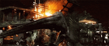a monster is attacking a building with flames coming out of it 's mouth