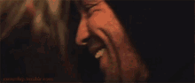 a close up of a man 's face with the website runninp.tumblr.com in the corner