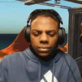a man wearing headphones with a l-alt edit watermark