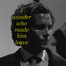 a man in a suit and tie with the words " i wonder who made him leave " above him