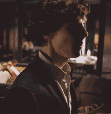 a close up of a man 's face with the word sherlock on the bottom