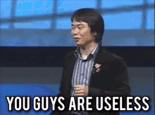 You Guys Are Useless Shigeru Miyamoto GIF - You Guys Are Useless Shigeru Miyamoto On Stage GIFs