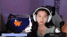 a woman wearing headphones and a shure microphone says shadow
