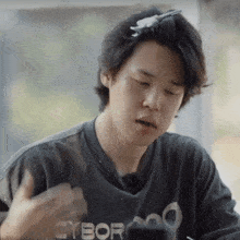 a man wearing a black shirt that says cyborg on it