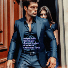 a man in a suit stands next to a woman in a black shirt and says noapte buna goodnight