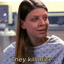 a woman in a hospital gown has the words they kill mice on her shirt