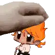 a cartoon character with orange hair is being held by a person 's hand .