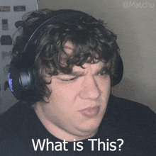 a man wearing headphones with the words what is this on the bottom