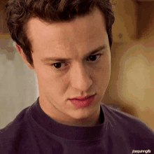 a close up of a young man 's face with joequinngifs written on the bottom right