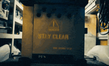 a sign that says danger stay clear on it