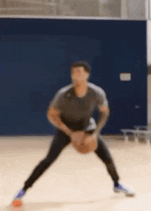 a man is dribbling a basketball on a court .