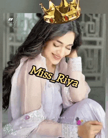 a woman wearing a crown on her head with the name miss riya on it