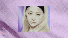 a woman with blonde hair and a black headband sits in front of a purple and white background