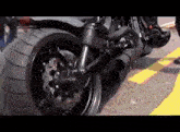 a motorcycle with a large tire is parked on the street