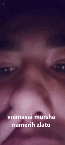 a close up of a person 's face with the words vnimavai mursha namerih zlato below