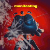 a poster with a blue crab and the word manifesting