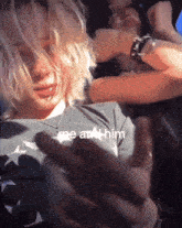 a person with a t-shirt that says " me at him " on it