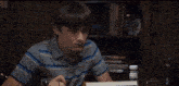 a person is sitting at a table with a plate of food and a glass of orange juice ..