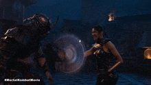a movie poster for the mortal kombat movie shows a man and woman fighting