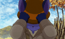 a cartoon cat wearing a hat covering his face