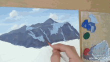 a person is painting a mountain with the words made in animotica behind them