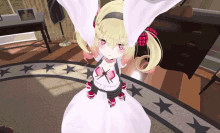 a girl in a white dress stands in a room with stars on the floor