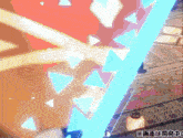a video game screen shows a blue sword with triangles on it and a lantern in the background