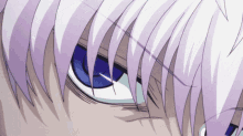 a close up of a person 's eyes with white hair and blue eyes