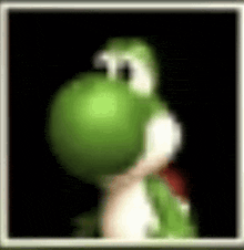 a blurry picture of a green cartoon character , yoshi , holding a turtle .