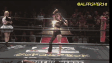 a woman in a wrestling ring with the name alfisher18 on the bottom right corner