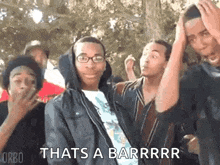 a group of young men are standing next to each other and making funny faces .