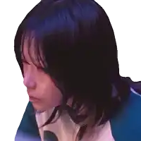 a close up of a woman 's face with a blue shirt on