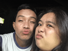 a man and a woman make funny faces together