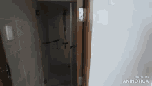 a bathroom with a shower and a door that says made in animatica