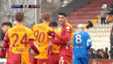 a group of soccer players wearing numbers 24 90 and 8