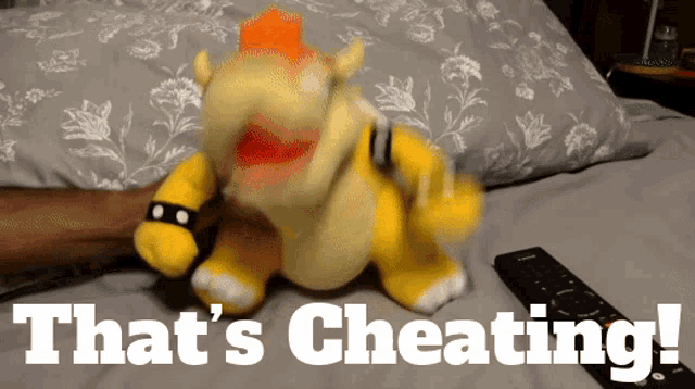 a stuffed animal with the words that 's cheating written below it