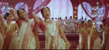 a group of women are dancing on a stage with the words eros on the bottom