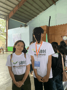 a man and a woman wearing sibol christian institute 2019 shirts stand next to each other