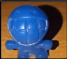 a blue toy with a football helmet on it