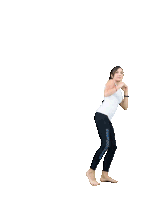 a woman in a white tank top and black leggings is dancing on one leg