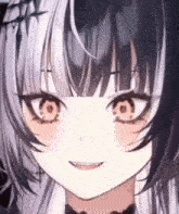 a close up of a girl 's face with a smile on her face