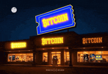 a building with a blue sign that says bitcoin