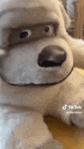 a stuffed animal with a mask on its face