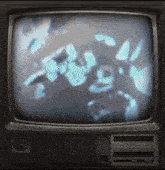 a television with a clock on the bottom right